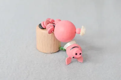 Produktbild von Holzspielzeug Wackeltier Glücksschwein Höhe 7,5cm NEU