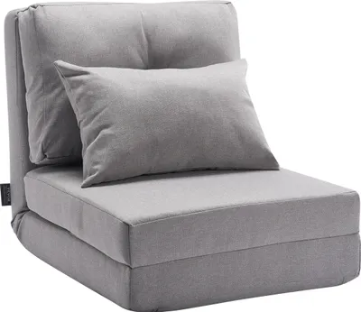 A gray convertible floor sofa with a pillow, shown in its upright chair configuration.