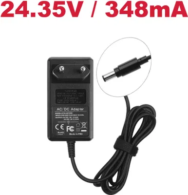 A black AC/DC adapter with a coiled cable and a close-up of the connector.