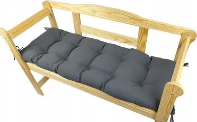 A wooden bench with a gray cushion on a white background.