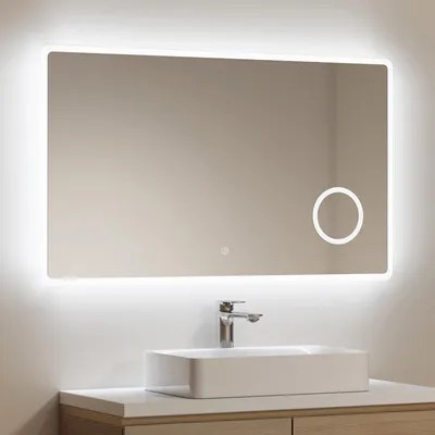 A modern bathroom vanity with a rectangular sink and a chrome faucet, with a large, illuminated LED mirror above it.