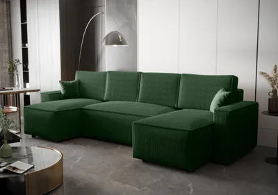 A dark green sectional sofa in a modern living room setting.