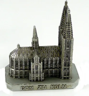 A miniature model of a cathedral on a white background.