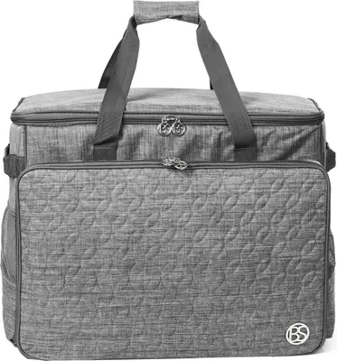 A gray sewing machine bag with quilted front panel and handles.