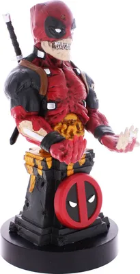 A figurine of Deadpool in a zombie-like state, standing on a pedestal.