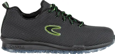 A side view of a black and green athletic shoe against a white background.