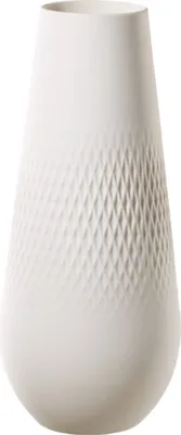 A white vase with a textured diamond pattern.