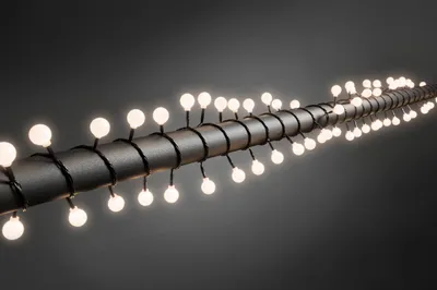 Produktbild von Konstsmide - LED Globelichterkette, große runde Dioden, 80 warm weiße Dioden, 24V Außentrafo, schwarzes Kabel ; 3696-107