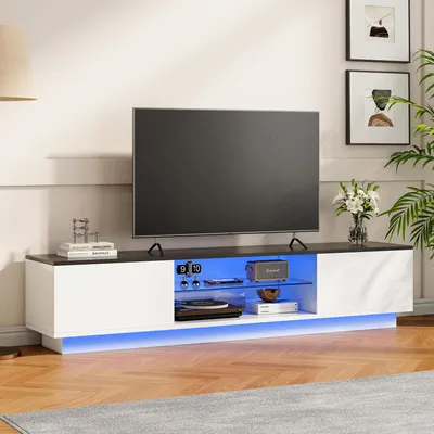 A modern TV stand with LED lighting in a living room setting.