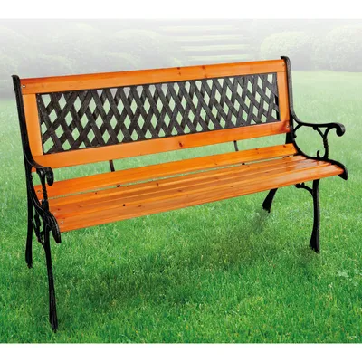 A park bench on a grassy lawn with a blurred background.
