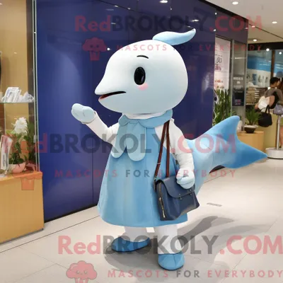 Image de Personnage mascotte REDBROKOLY d un béluga bleu habillé d une mini robe et de sacs besaces
