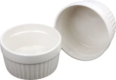 Two white ceramic ramekins are shown against a white background.