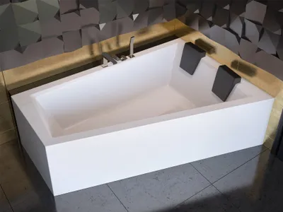 A modern white bathtub with two black headrests is shown in a bathroom setting with a textured dark gray wall and gray tiled floor.
