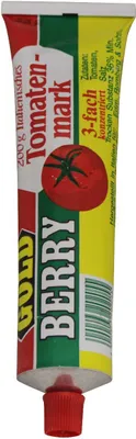 A tube of tomato paste with branding and ingredient information.