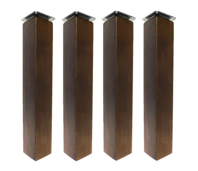 Four wooden furniture legs with metal caps on a white background.