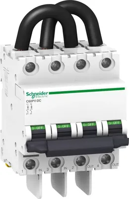 A white Schneider Electric C60PV-DC circuit breaker with black cables connected to the top and green and white switches on the front.