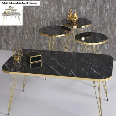 A set of nesting tables with a marble design and gold legs, along with a coffee table with a similar design.