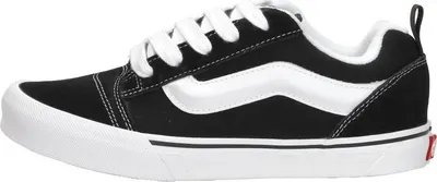 A side view of a single black Vans Knu Skool sneaker with white accents and laces, placed on a white background.