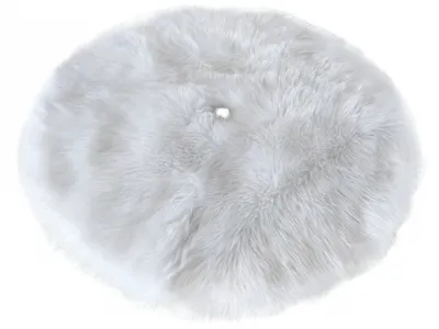 A round, white, fluffy rug is shown from a top-down perspective against a white background.