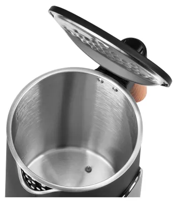 Close-up view of the inside of an electric kettle with the lid open.