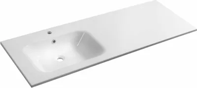 A white ceramic sink with a countertop.