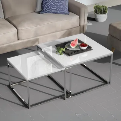 A living room setting with a sofa and nesting coffee tables.