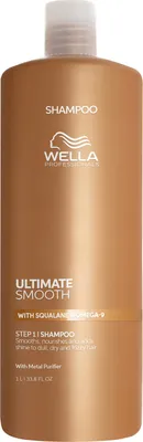 A studio shot of a large bottle of Wella Ultimate Smooth Shampoo.