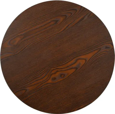 A close-up view of a round, dark brown wooden table top with visible wood grain.