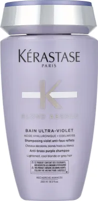 A bottle of Kerastase Blond Absolu Bain Ultra-Violet shampoo.