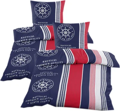 A stack of nautical-themed bedding sets, including pillowcases and duvet covers, displayed against a white background.