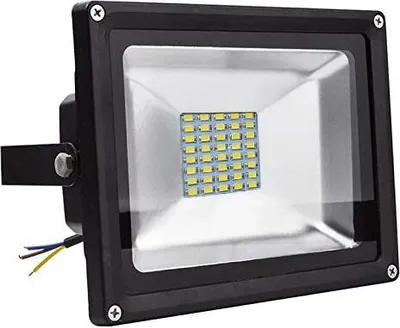 A close-up, front-facing view of a black LED floodlight with a grid of yellow LED lights visible behind a clear glass panel.