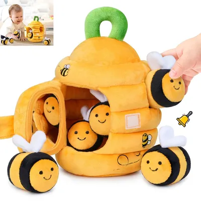 A plush beehive toy with bees, presented on a white background.