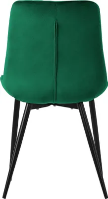 The back view of a dark green velvet chair with black metal legs.