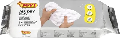 A package of white air-dry modeling clay, with hands holding some of the clay.