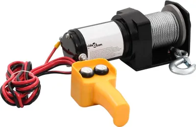 A product shot of an electric winch with a remote control.