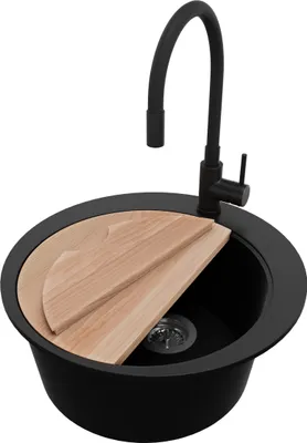 A black kitchen sink with a black faucet and a wooden cutting board.
