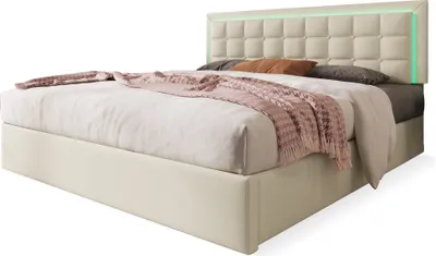 A bed with a headboard and bedding, set against a white background.