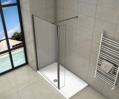 A modern bathroom with a walk-in shower, a towel rack, and a large window overlooking a tropical scene.