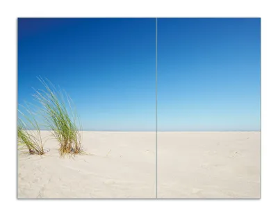 Produktbild von Wallario Herdabdeckplatte aus Glas, Größe 70 x 52 cm 2-teilig, Motiv Sandstrand unter blauem Himmel