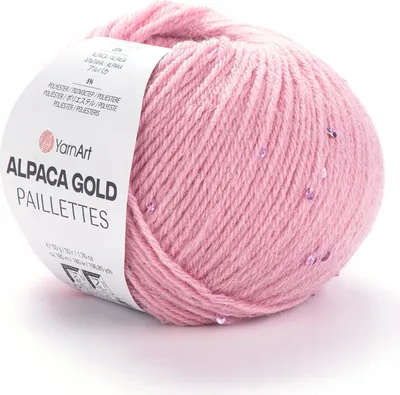A ball of pink yarn with sequins, with a label attached.
