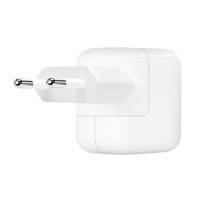 A white Apple USB power adapter with two prongs for European outlets.
