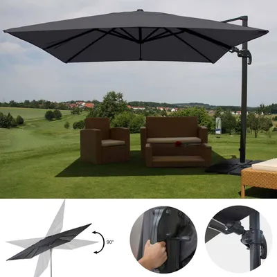 An outdoor patio setting with a large cantilever umbrella providing shade over outdoor furniture.