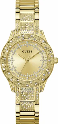 A close-up studio shot of a gold-colored Guess watch with crystal embellishments.