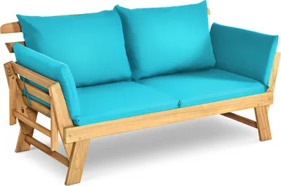 A wooden outdoor sofa with blue cushions on a white background.