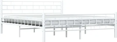 A white metal bed frame with a mattress on a white background.