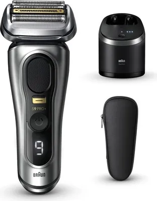 A silver and black electric shaver with its charging base and travel case, displayed on a white background.