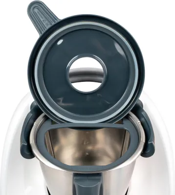 A close-up view of the lid and inner bowl of a kitchen appliance.