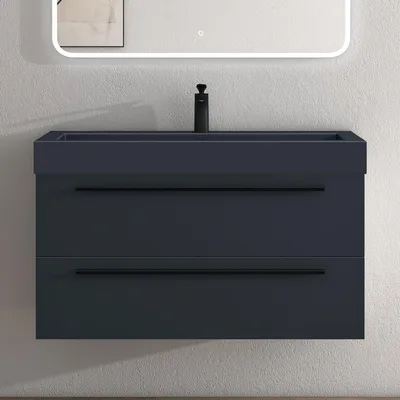 A modern, wall-mounted bathroom vanity with a sink and faucet against a textured wall, with a mirror above.