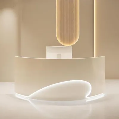 A modern reception desk with integrated lighting.