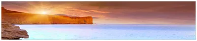 Produktbild von Wallario Küchenrückwand aus Glas, Größe: 250 x 50 cm, Motiv: Sonnenaufgang am Meer mit Landzunge und Felsen im Wasser | Spritzschutz | abwischbar | pflegeleicht | in